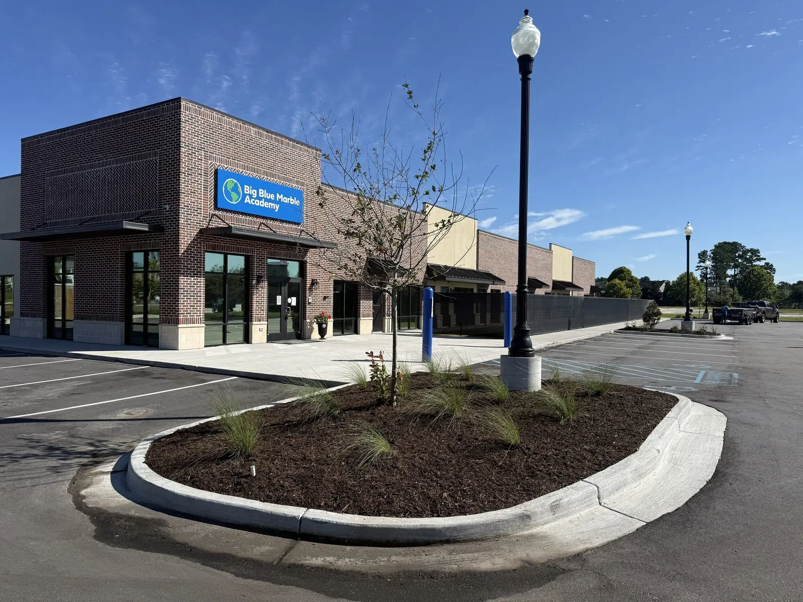 A childcare center property with a fresh landscape bed